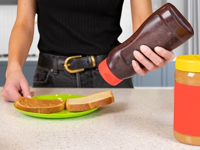 Plastic sauce bottle in use, a Berry Global Product